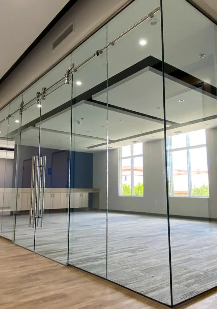 Modern impact sliding doors opening to a patio area