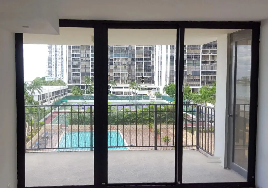 Impact bi-fold doors connecting indoor and outdoor living spaces